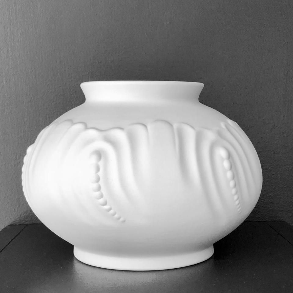 Unglazed round vase